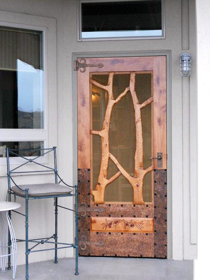 Double sided, hand carved Forest Screen Doors with patina copper overlay as a protect buffer from weather, feet and scratching dogs