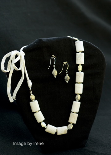 White jasper with base metal beads on white leather, can be tied to various lengths, matching base metal earrings on silver plated ear wires.  $35 for the set.