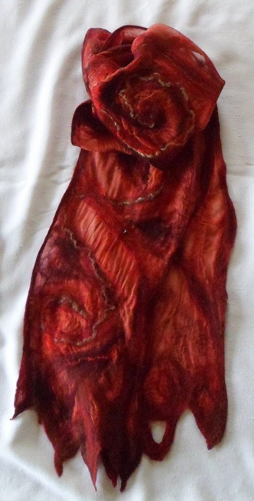 Red and Black Merino wool on eco-dyed madder-root silk panel. 8" x 76" SOLD