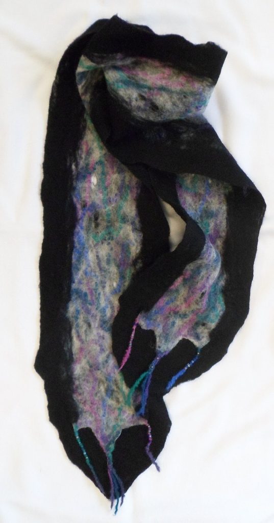 Grey & Black Merino Wool with cool colored wool yarn accents.  7.5" x 72"  $45