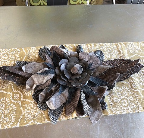 Recycled wool fabrics paired with metal punch-outs for a beautiful centerpiece.