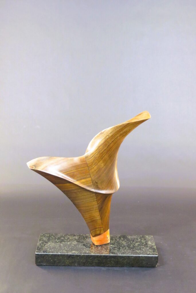 On Wings, Black Walnut and Alabaster on marble base (rotates), 16" x 12" x 5"