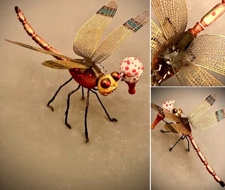 “DragonLady Brings a Cone”
She’s a split personality, she is. Sometimes a voracious, meat-eating predator and, sometimes, a sweet one with a heart of gold. A treat in any case because each new day brings a surprise. You just plain can’t predict what face she’ll wear tomorrow.
Dragonfly: 4”X5”X2”. The thorax is epoxy clay, the abdomen is turned aluminum 62, the legs are steel wire and the wings are lasered metal. Acrylic airbrushed and 3-d paint colors and the finish is clear lacquer.